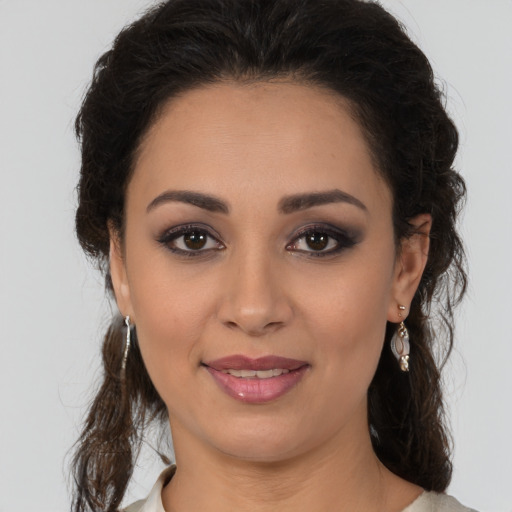 Joyful white young-adult female with medium  brown hair and brown eyes