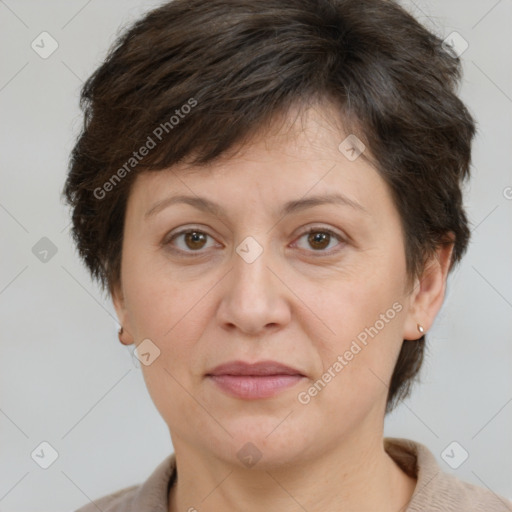 Joyful white adult female with short  brown hair and brown eyes