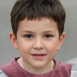 Joyful white child male with short  brown hair and brown eyes