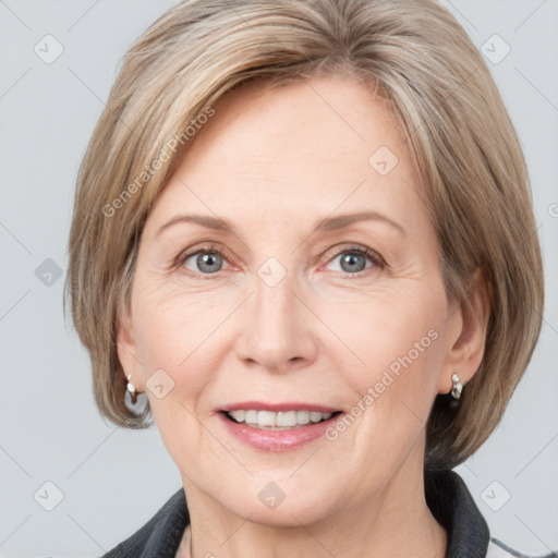 Joyful white adult female with medium  brown hair and grey eyes