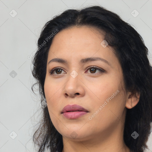 Joyful latino young-adult female with medium  black hair and brown eyes