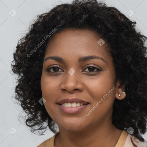 Joyful black young-adult female with long  brown hair and brown eyes