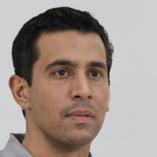 Neutral latino young-adult male with short  black hair and brown eyes