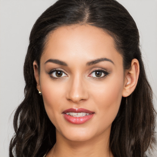 Joyful white young-adult female with long  brown hair and brown eyes