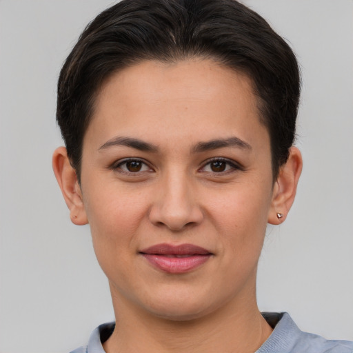 Joyful white young-adult female with short  brown hair and brown eyes
