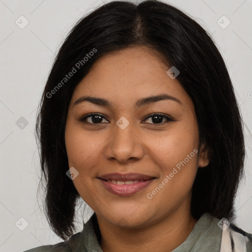 Joyful latino young-adult female with medium  brown hair and brown eyes