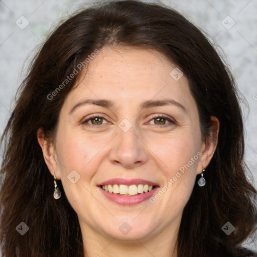 Joyful white adult female with long  brown hair and brown eyes