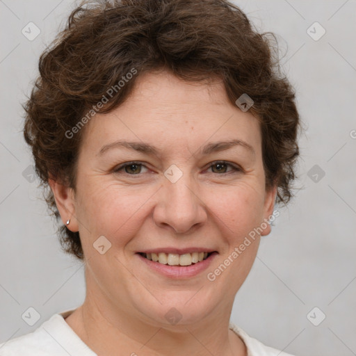 Joyful white adult female with short  brown hair and brown eyes