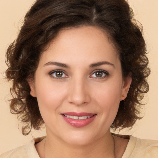 Joyful white young-adult female with medium  brown hair and brown eyes