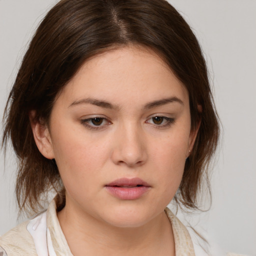 Neutral white young-adult female with medium  brown hair and brown eyes