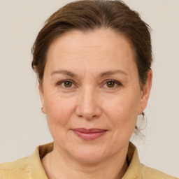 Joyful white adult female with short  brown hair and brown eyes