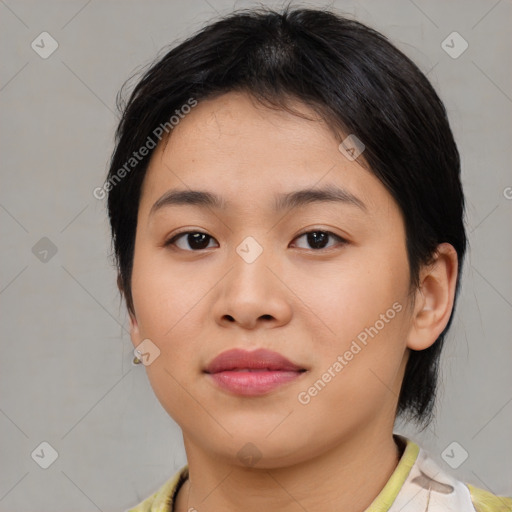 Joyful asian young-adult female with medium  brown hair and brown eyes