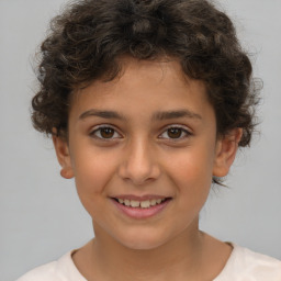 Joyful white child female with short  brown hair and brown eyes