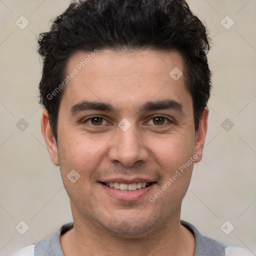 Joyful white young-adult male with short  black hair and brown eyes