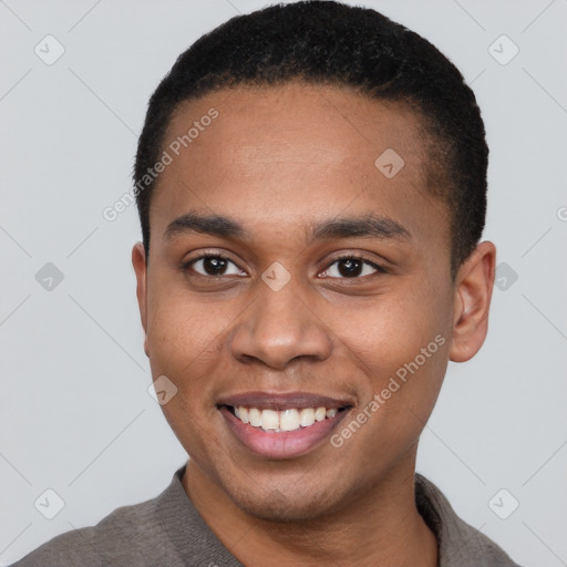 Joyful black young-adult male with short  brown hair and brown eyes