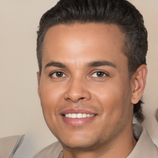 Joyful white young-adult male with short  brown hair and brown eyes