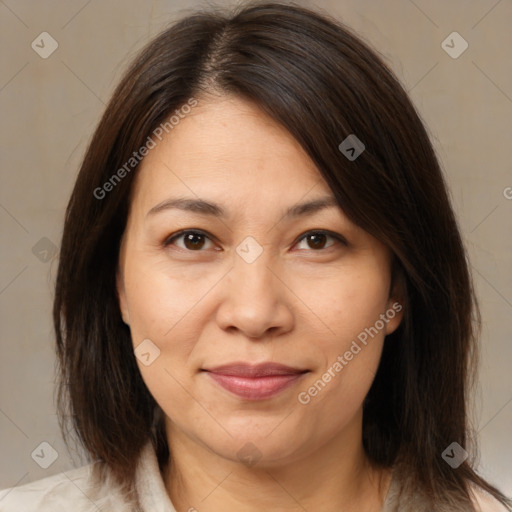 Joyful white adult female with medium  brown hair and brown eyes