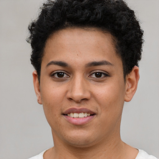 Joyful latino young-adult female with short  brown hair and brown eyes