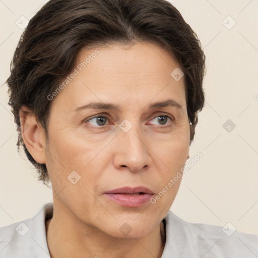 Joyful white adult female with short  brown hair and brown eyes