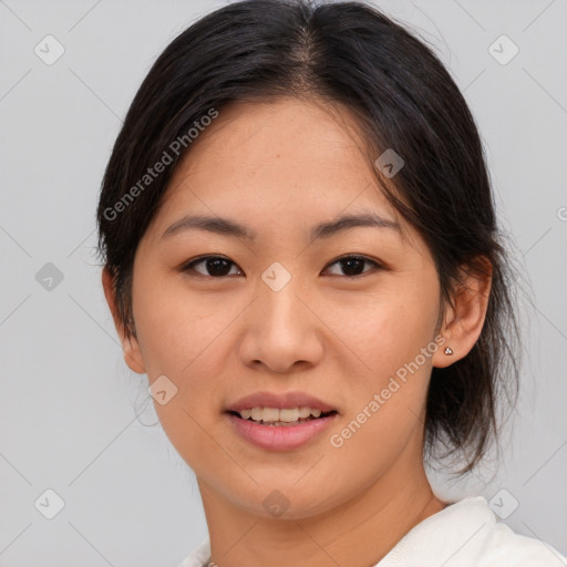 Joyful asian young-adult female with medium  brown hair and brown eyes