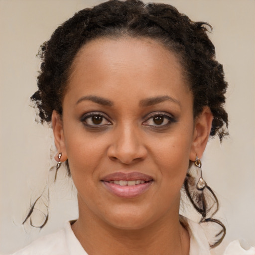 Joyful black young-adult female with medium  brown hair and brown eyes
