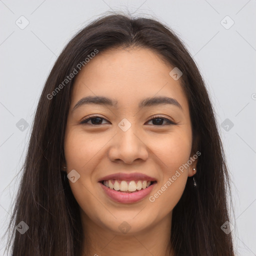 Joyful latino young-adult female with long  brown hair and brown eyes