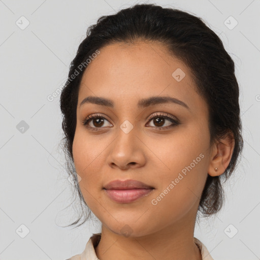 Joyful latino young-adult female with long  black hair and brown eyes