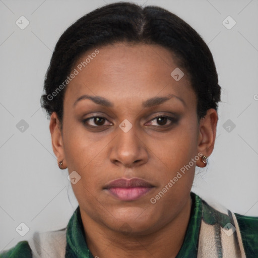 Joyful latino adult female with short  brown hair and brown eyes