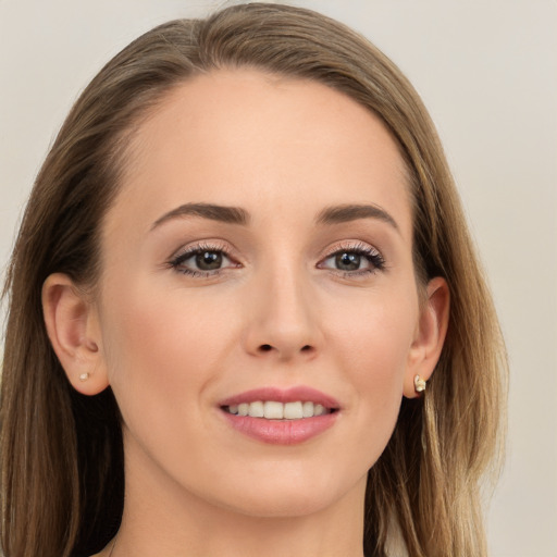 Joyful white young-adult female with long  brown hair and grey eyes