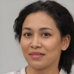 Joyful white adult female with medium  brown hair and brown eyes