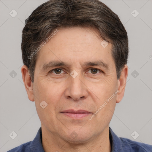 Joyful white adult male with short  brown hair and brown eyes