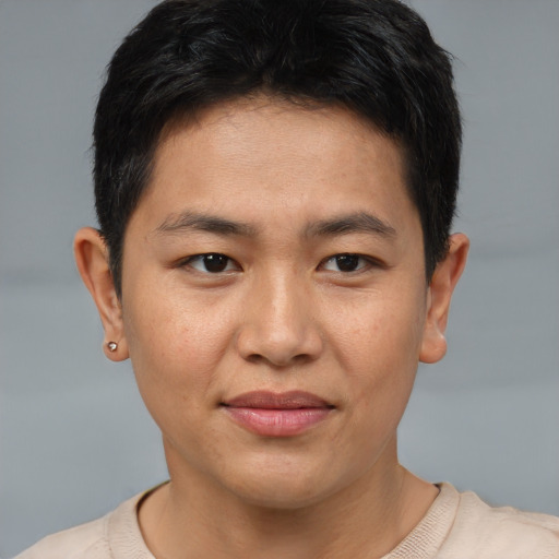 Joyful asian young-adult male with short  brown hair and brown eyes
