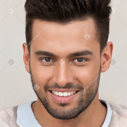 Joyful white young-adult male with short  brown hair and brown eyes