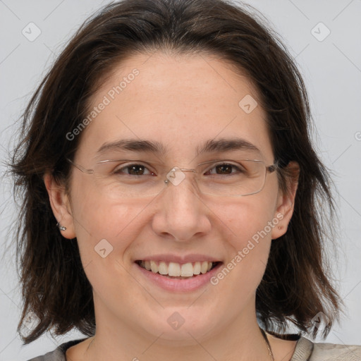 Joyful white adult female with medium  brown hair and brown eyes