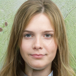 Joyful white young-adult female with long  brown hair and green eyes