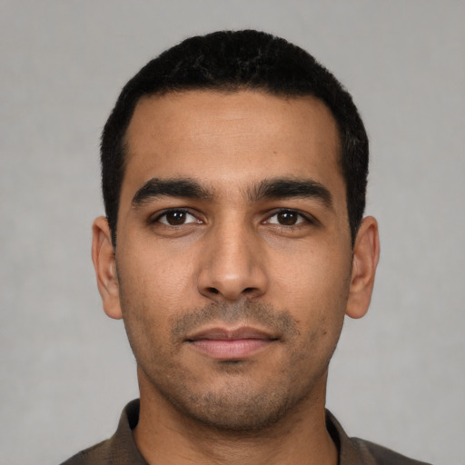 Neutral latino young-adult male with short  black hair and brown eyes