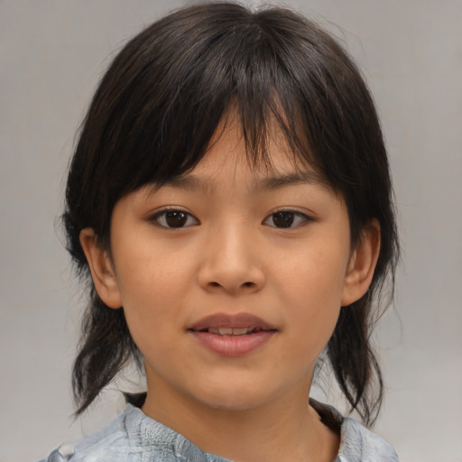 Joyful asian child female with medium  brown hair and brown eyes
