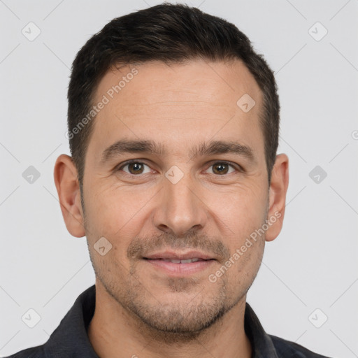 Joyful white young-adult male with short  brown hair and brown eyes