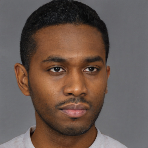 Neutral black young-adult male with short  brown hair and brown eyes