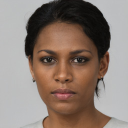 Neutral black young-adult female with short  black hair and brown eyes