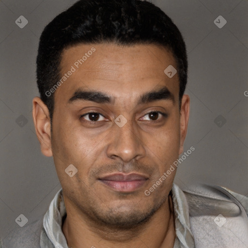 Joyful latino young-adult male with short  black hair and brown eyes