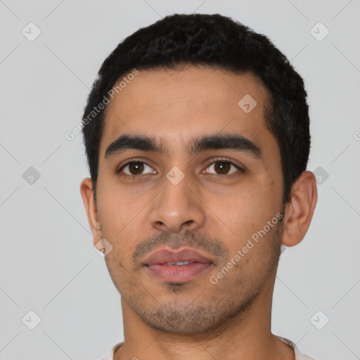 Neutral latino young-adult male with short  black hair and brown eyes