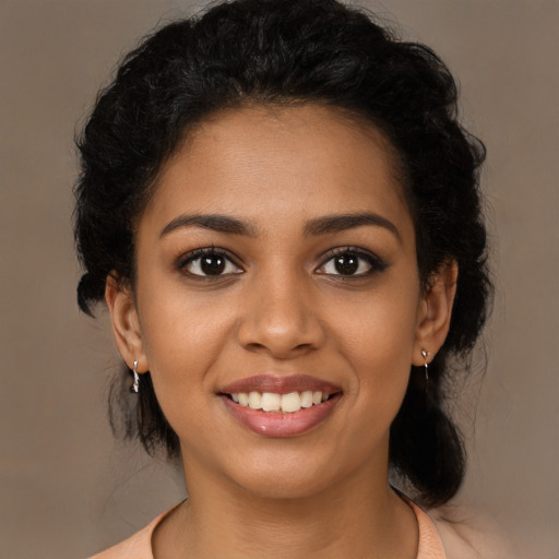 Joyful latino young-adult female with medium  black hair and brown eyes