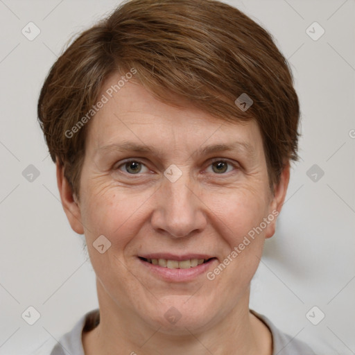 Joyful white adult female with short  brown hair and brown eyes