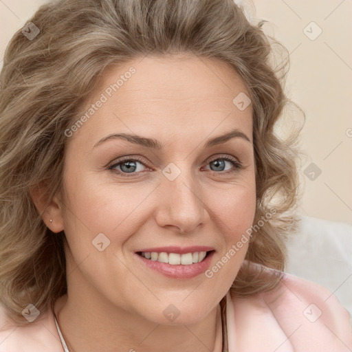 Joyful white adult female with medium  brown hair and blue eyes