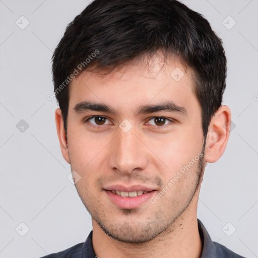 Joyful white young-adult male with short  black hair and brown eyes