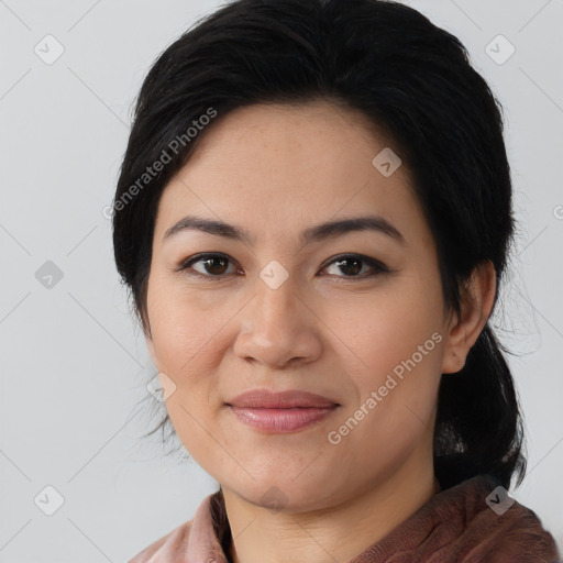 Joyful latino young-adult female with medium  brown hair and brown eyes