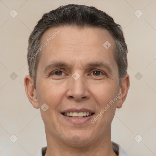 Joyful white adult male with short  brown hair and brown eyes