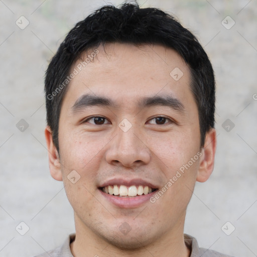 Joyful asian young-adult male with short  black hair and brown eyes