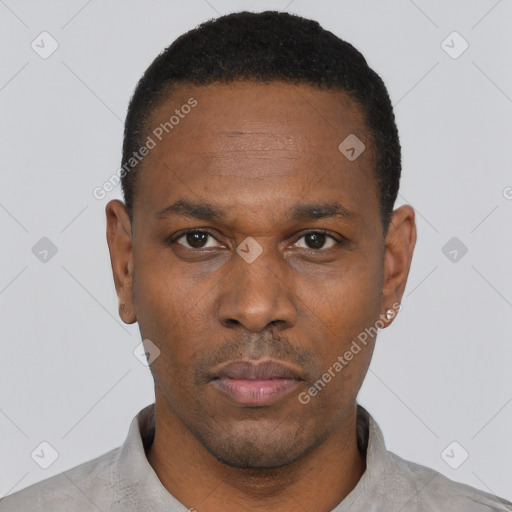 Neutral black adult male with short  black hair and brown eyes
